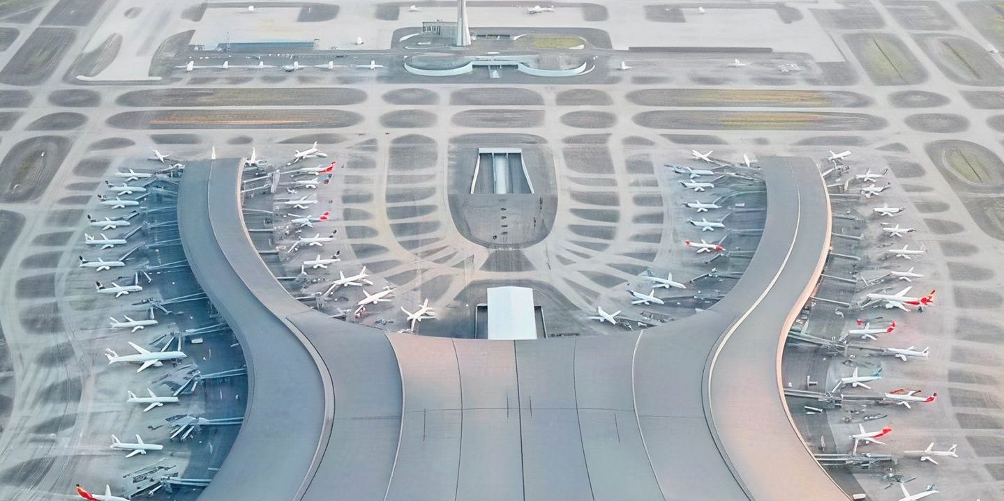 Aerial view of a terminal at Chongqing Jiangbei International Airport, with aircraft parked at the gates